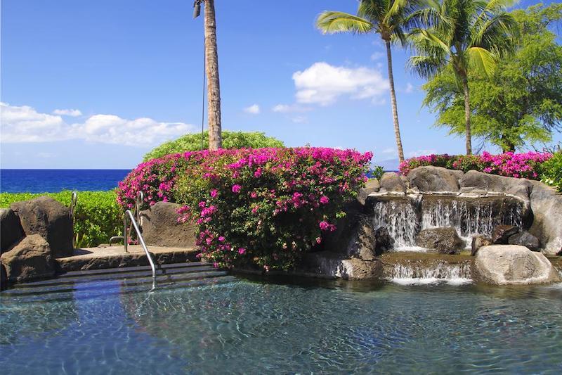 Waterfalls help landscape the serene pool area