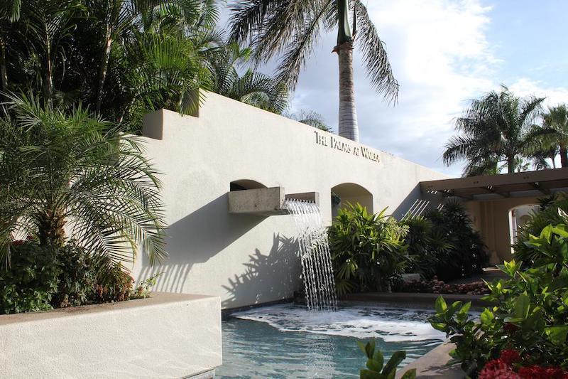 The Palms at Wailea entrance with a waterfall feature