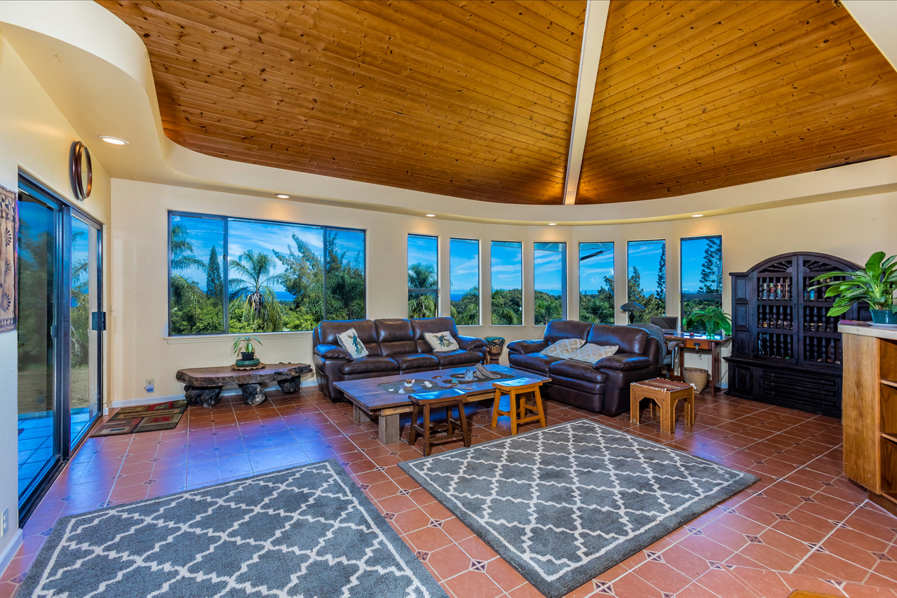 Warm & Inviting custom home: Living room with high vaulted ceilings.